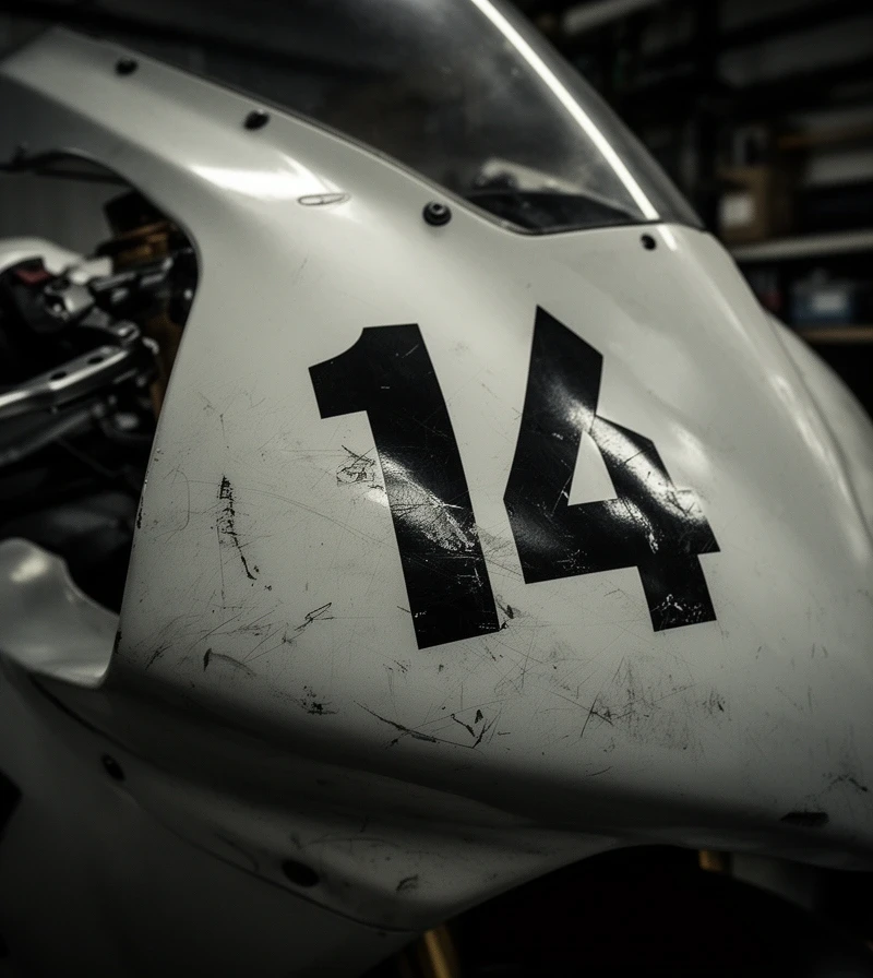 Close-up of a sport-bike fairing under garage lights