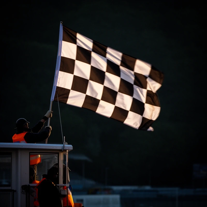 A chequered flag mid-wave on a track marshal post